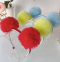 Tiara com pompom duplo