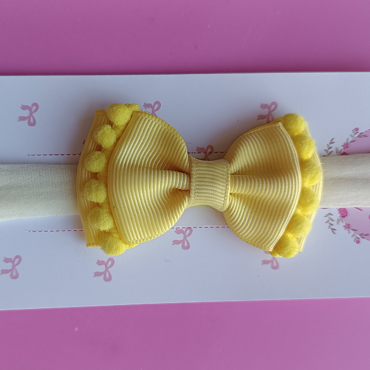 Faixinha gravata pompom - Amarelo