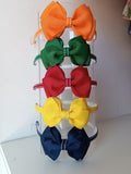 Tiara laço cruzado duplo - Amarela